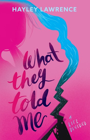 A pink cover wth a darker pink shadow of a girl next to a blue river that is curved and bumpy, and then forked. Pinkish purple text says What They Told Me. The author's name, Hayley Lawrence, is in light blue at the top, and a tag line A life divided in in blue at the bottom.