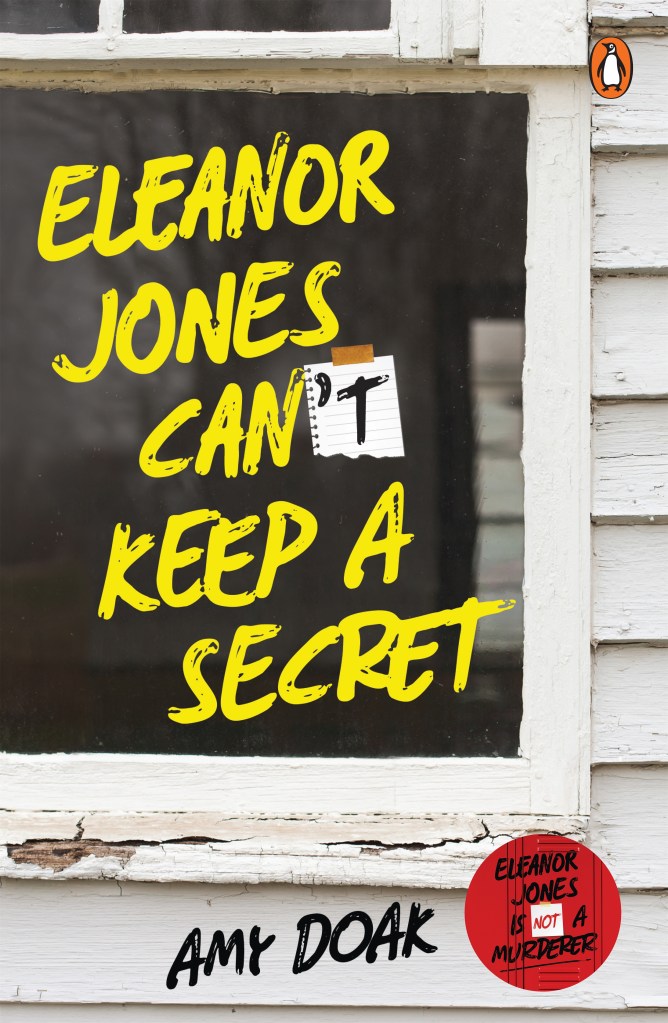 A white weatherboard wall and window with yellow text that says Eleanor Jones Can't Keep a Secret. 