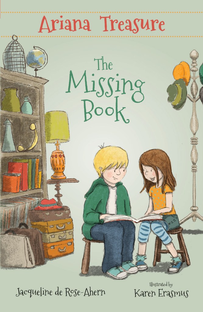 A green cover with a bookshelf, a lamp. ad a hatstand with colourful hats. A girl with brown hair in orange and blue and a boy with blonde hair in dark pants and a green top are looking at a book together on stools.
