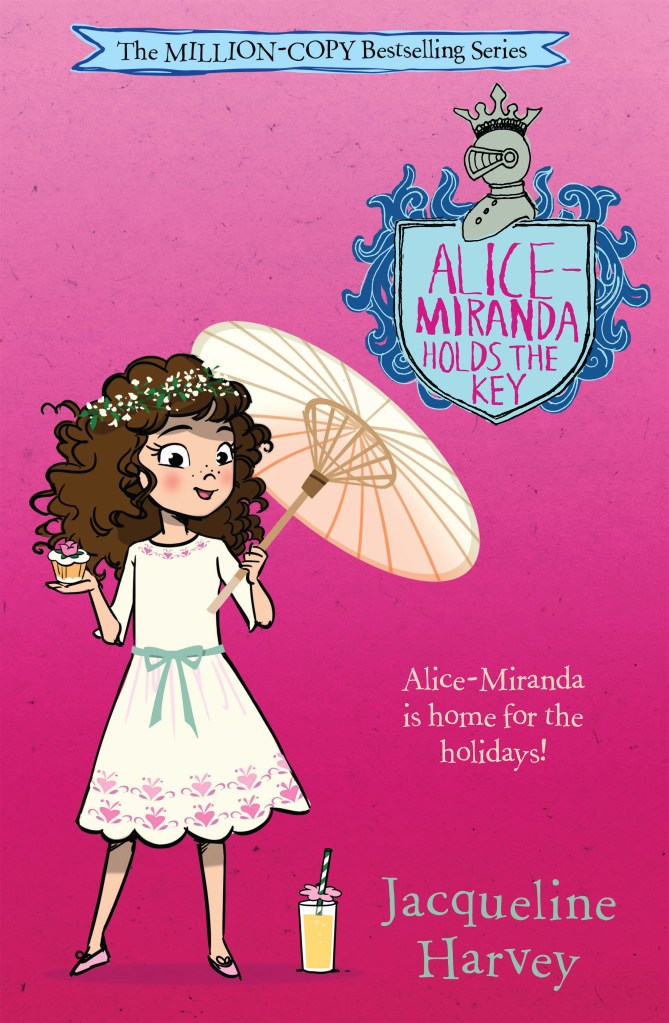Alice-Miranda Holds the Key
A bright pink cover with a brown-haired girl in a white dress with a parasol. She is holding a cupcake. A blue shield with pink text is at the top. Pink text says Alice-Miranda Holds the Key by Jacqueline Harvey.