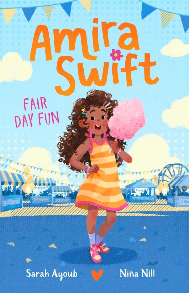 Amira Swift: Fair Day Fun 

Amira in an orange and yellow dress holding some fairy floss in front of a blue and yellow fair. Title text is in orange and pink.
